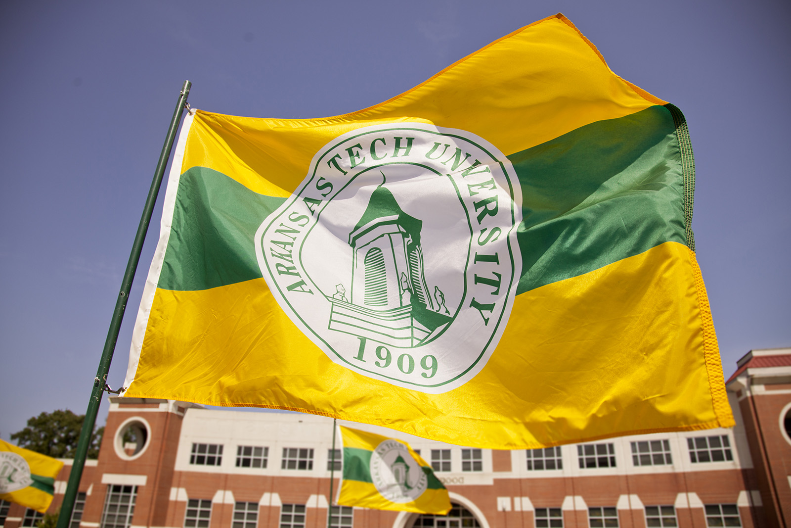 The Arkansas Tech University flag blowing in the wind