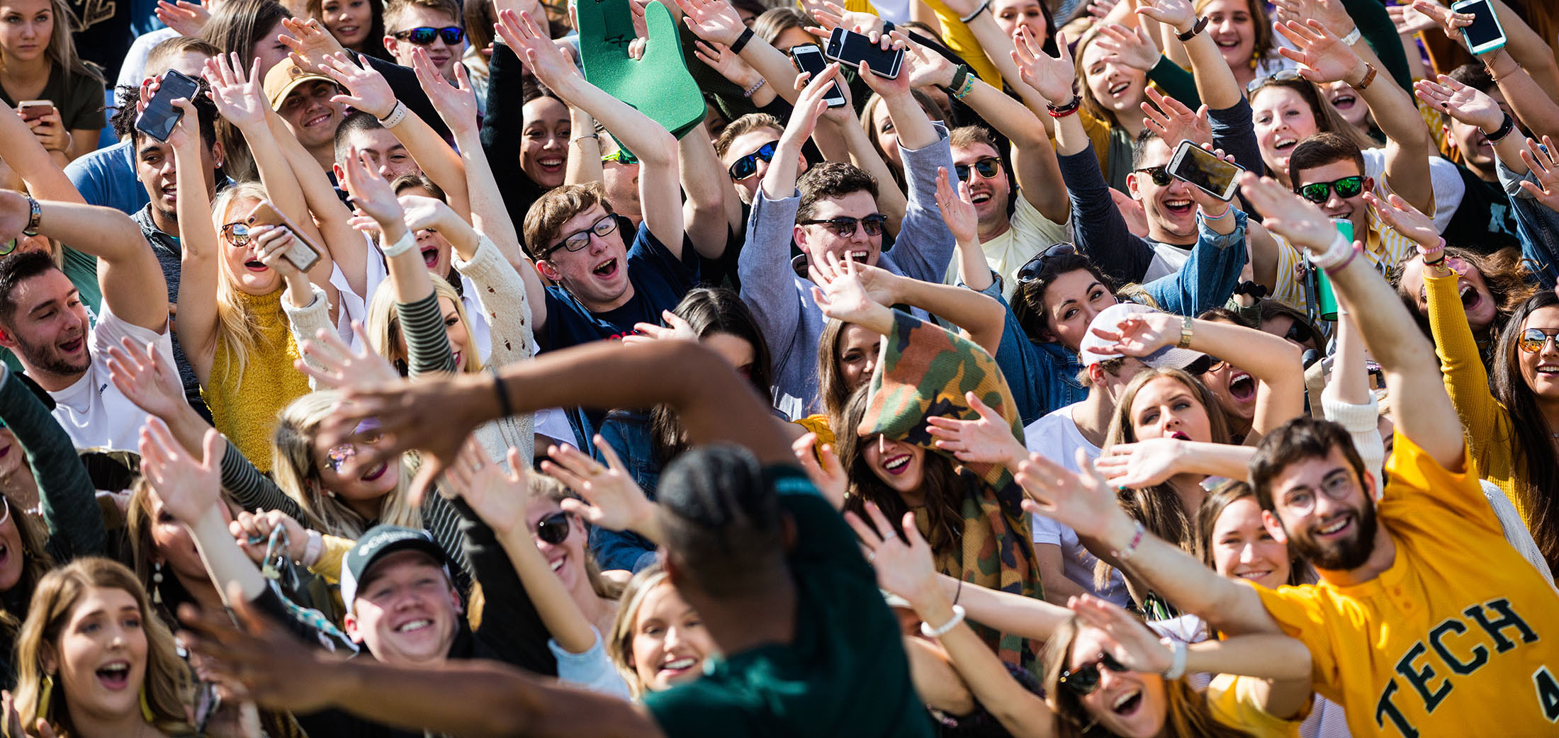 students celebrating at a football game