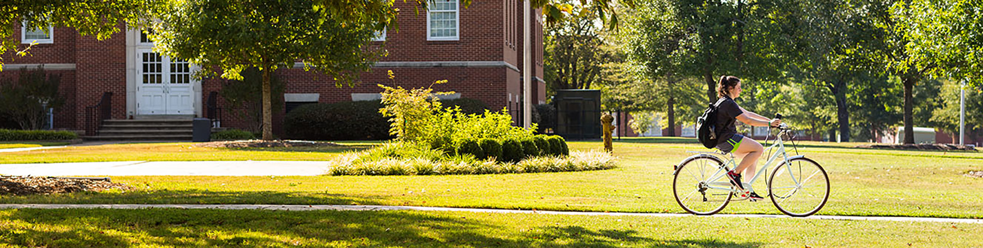  student commuting to campus on a bicycle