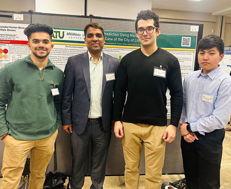 A team led by Zurab Sabakhtarishvili collected the first-place prize in the undergraduate poster presentation competition. Hiromi Honda, Clayton Jensen and Sijan Panday also contributed to the poster, which dealt with crime prediction in Little Rock using machine learning.