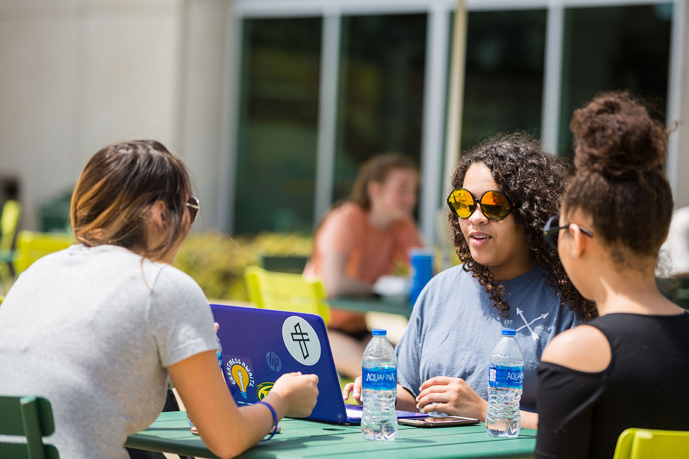 a group of female students catching up outside of baswell techionery