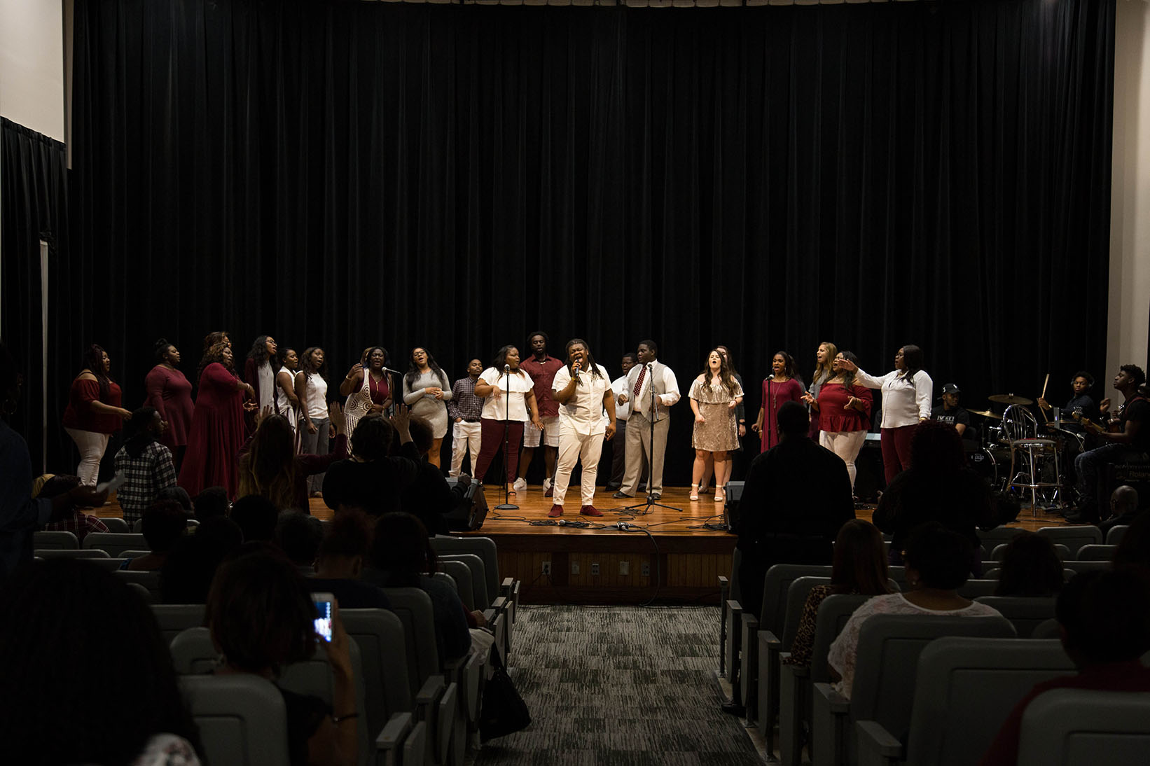 United Voices of Praise Choir group raise their voices in song at a concert