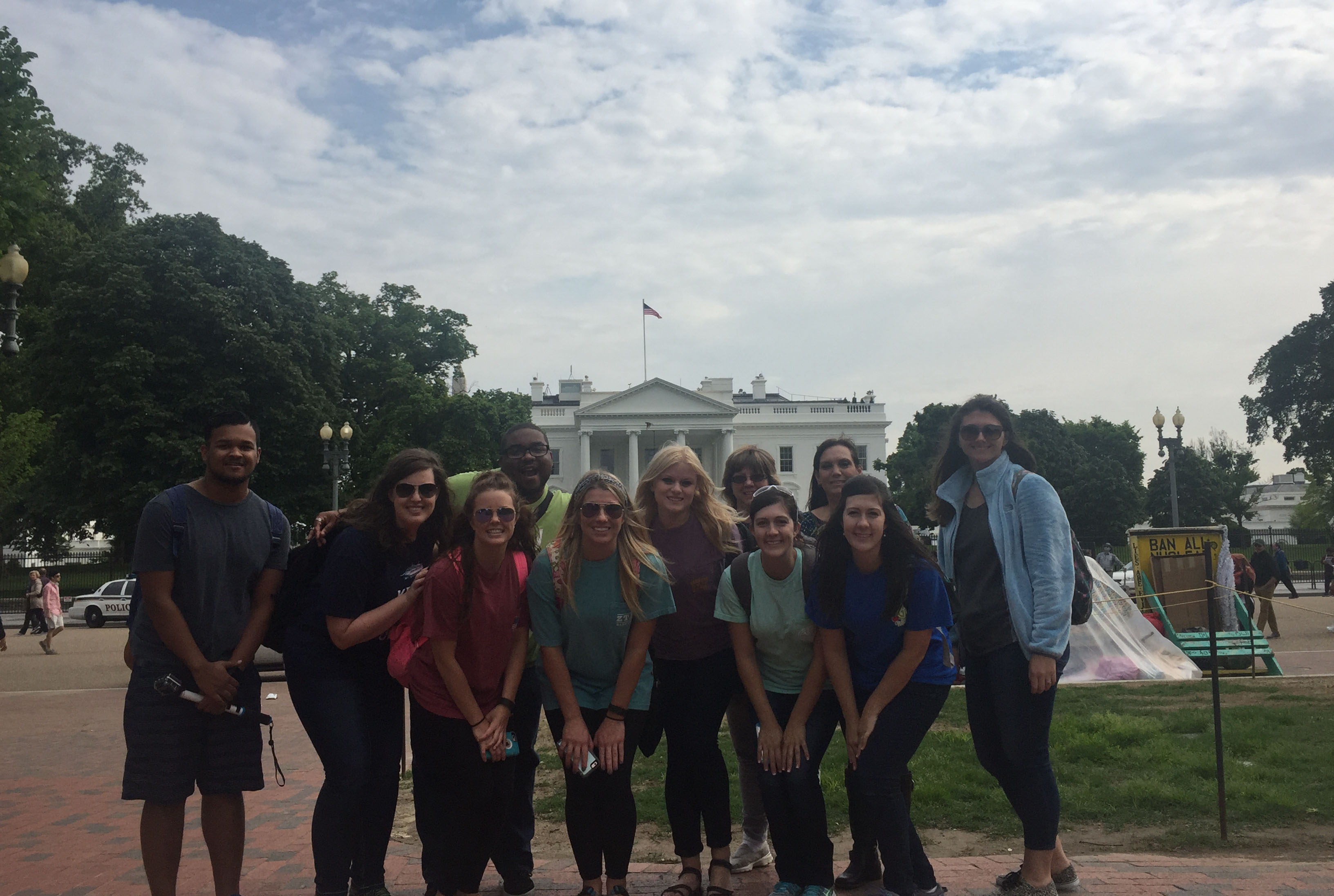 Student who completed their On Track requirements pose outside the White House