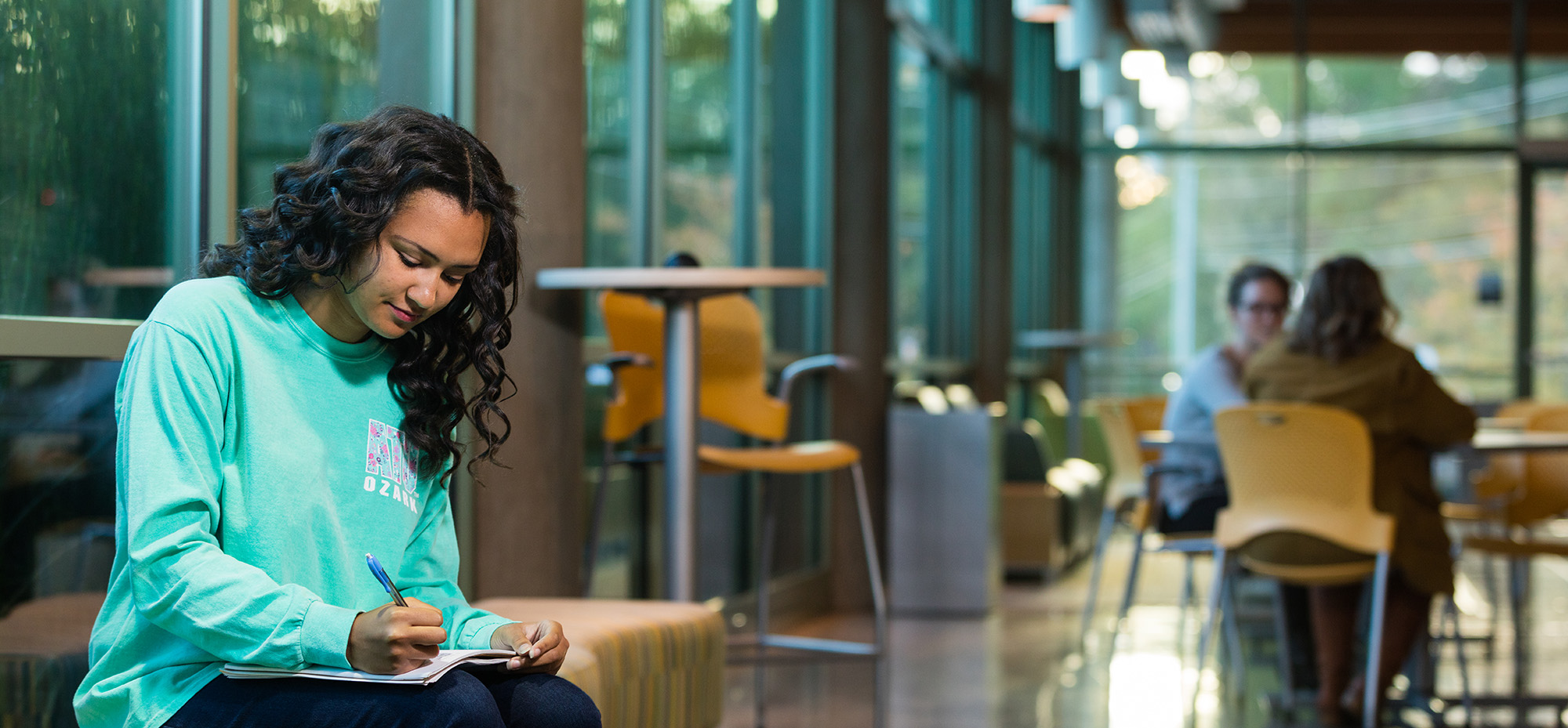 Photo of a student studying at the Ozark Campus