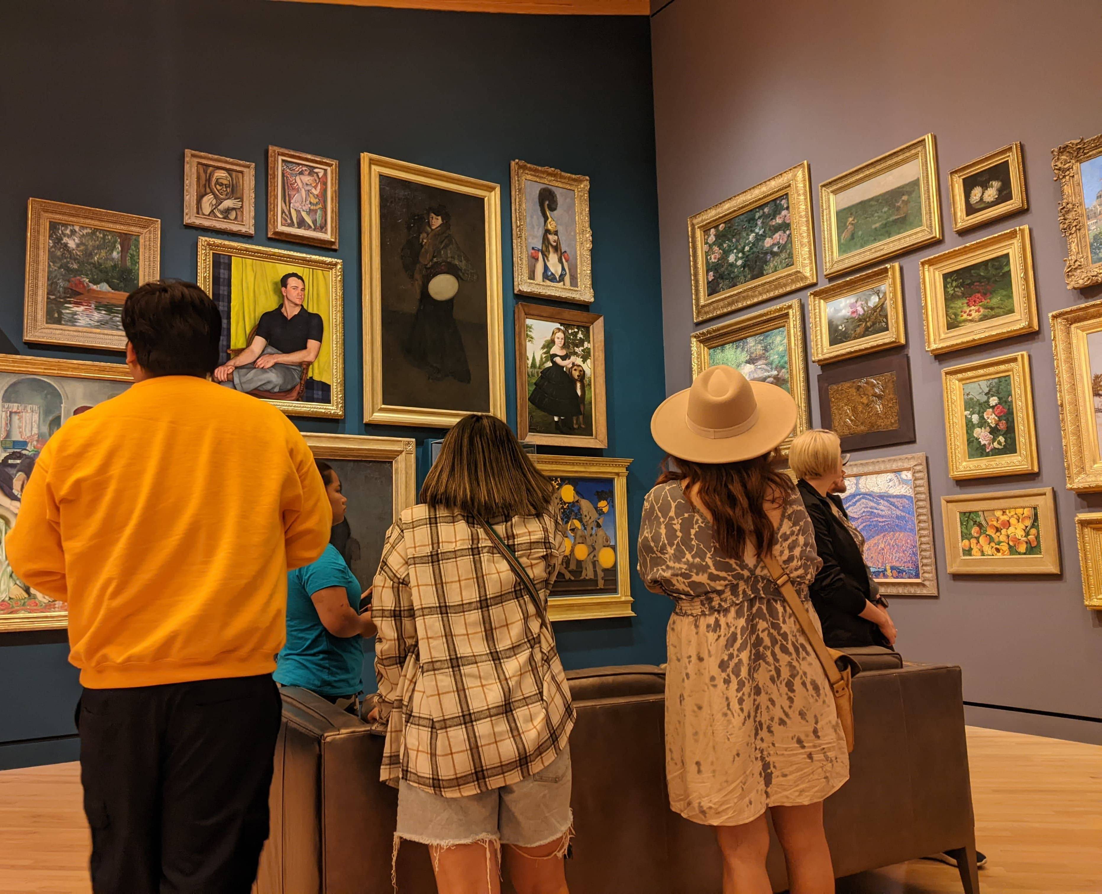 Students looking at a gallery wall at crystal bridges