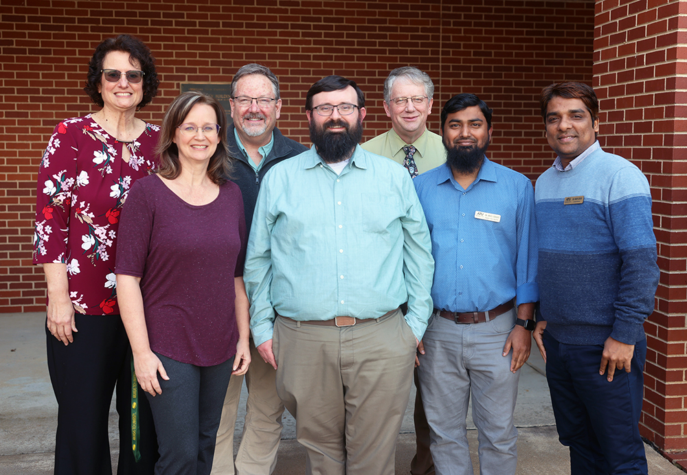 Photographed: (back row, left-to-right) Dr. Jeanine Myers, Dr. John Jackson, Dr. John Krohn; (front row, left-to-right) Rebecca Cunningham, Dr. Matthew Hankins, Dr. Abdus Siddique and Dr. Robin Ghosh. Not photographed: Dr. Jessica Young and Dr. Hamed Shojaei.