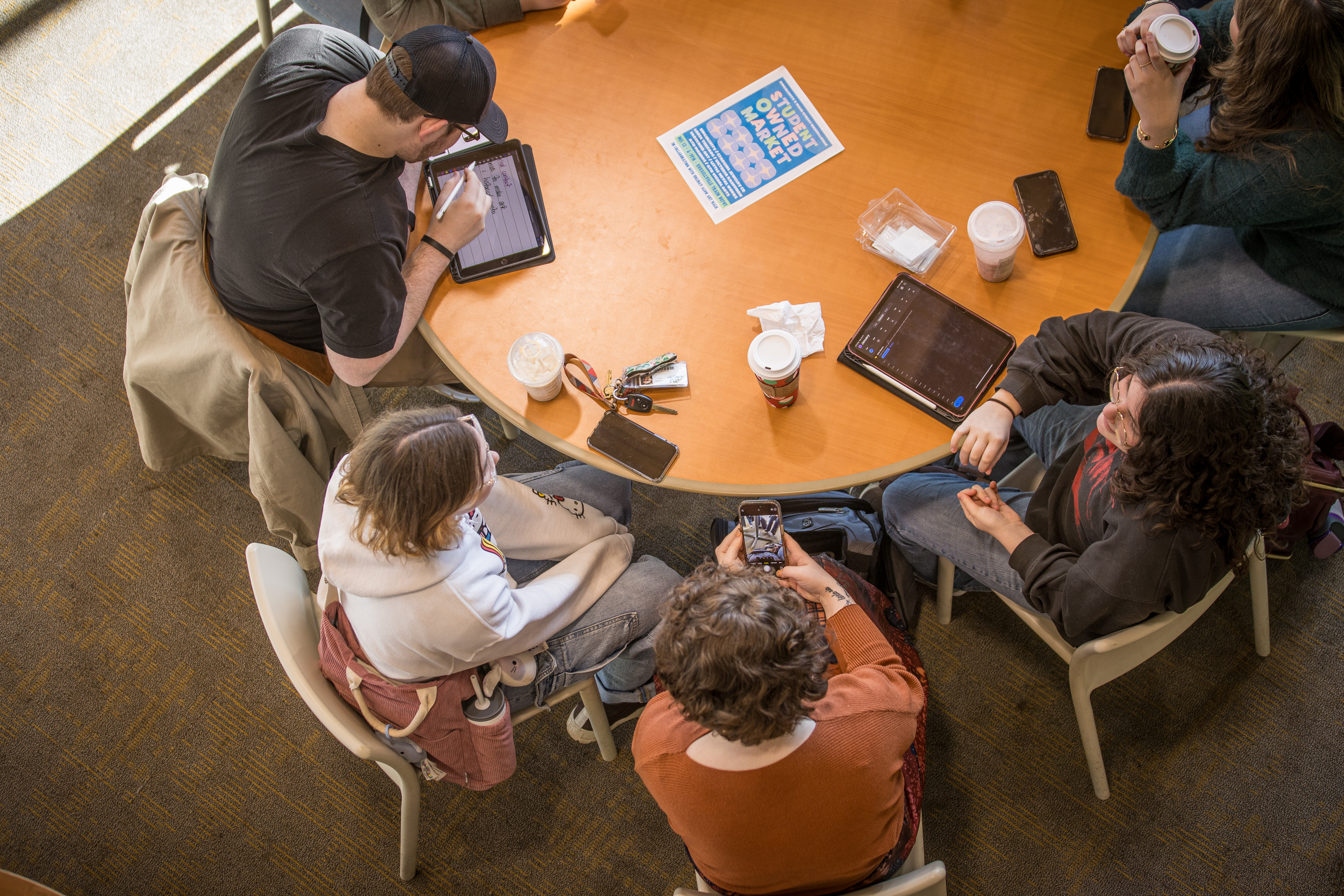 Students around a table studying