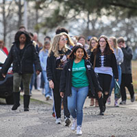 students and parents take a tour of campus